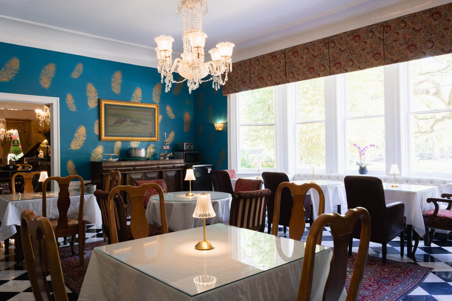 Interior dining room in hotel with chandelier overhead