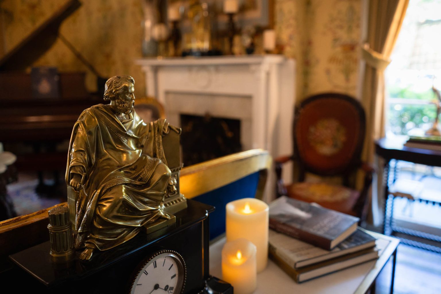 Decor including statue atop of clock and some candles at hotel in New Orleans