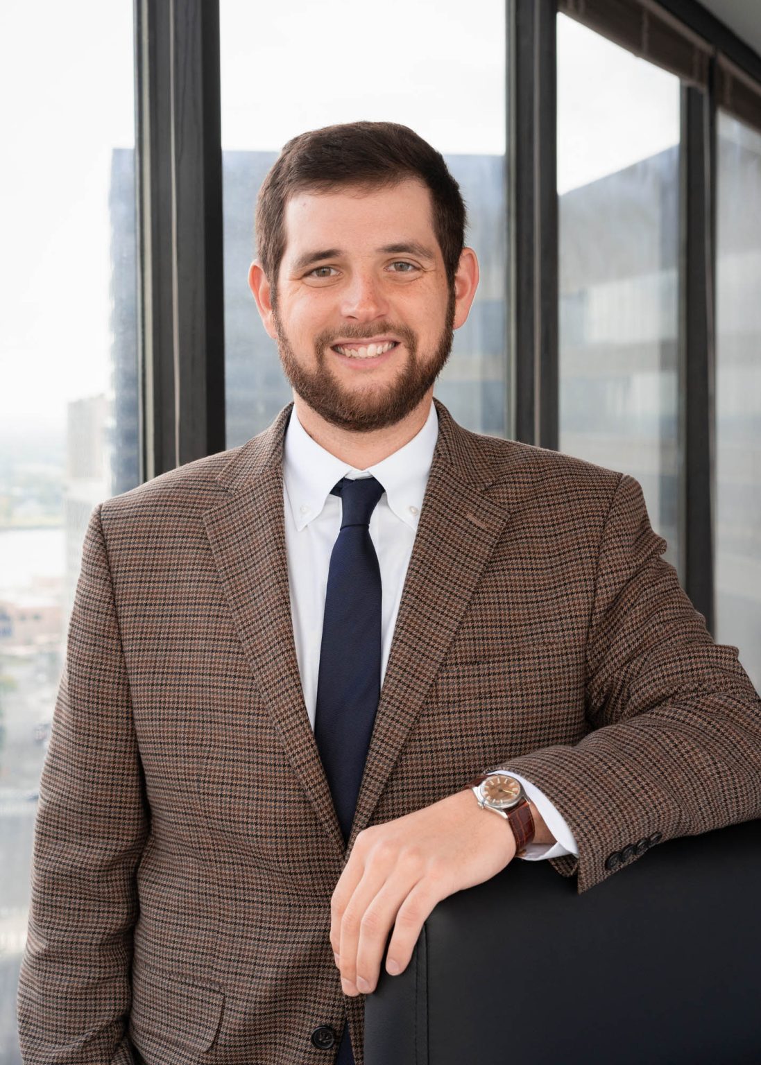 Smiling lawyer in his NOLA office building