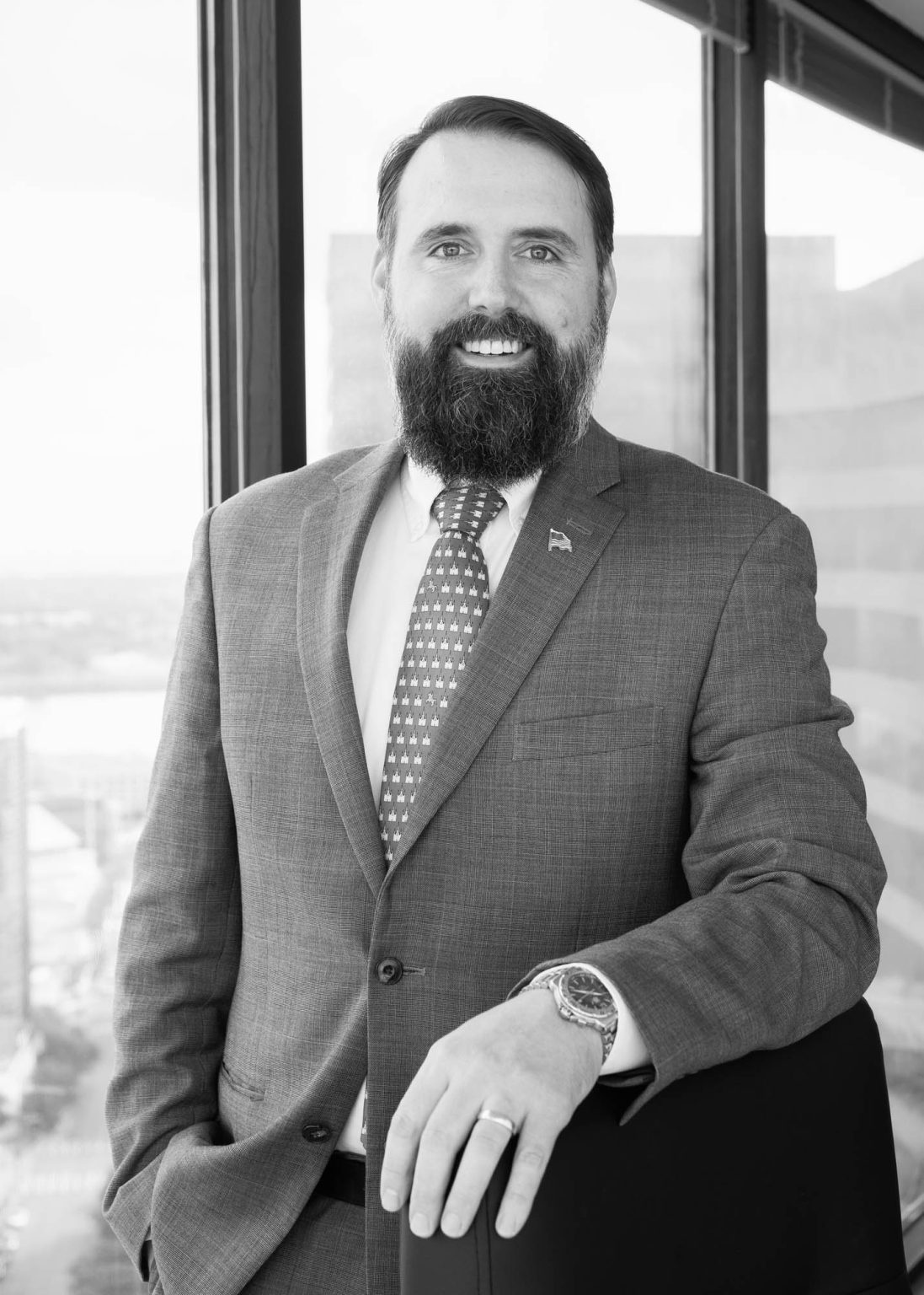 Lawyer smiling for portrait in his office