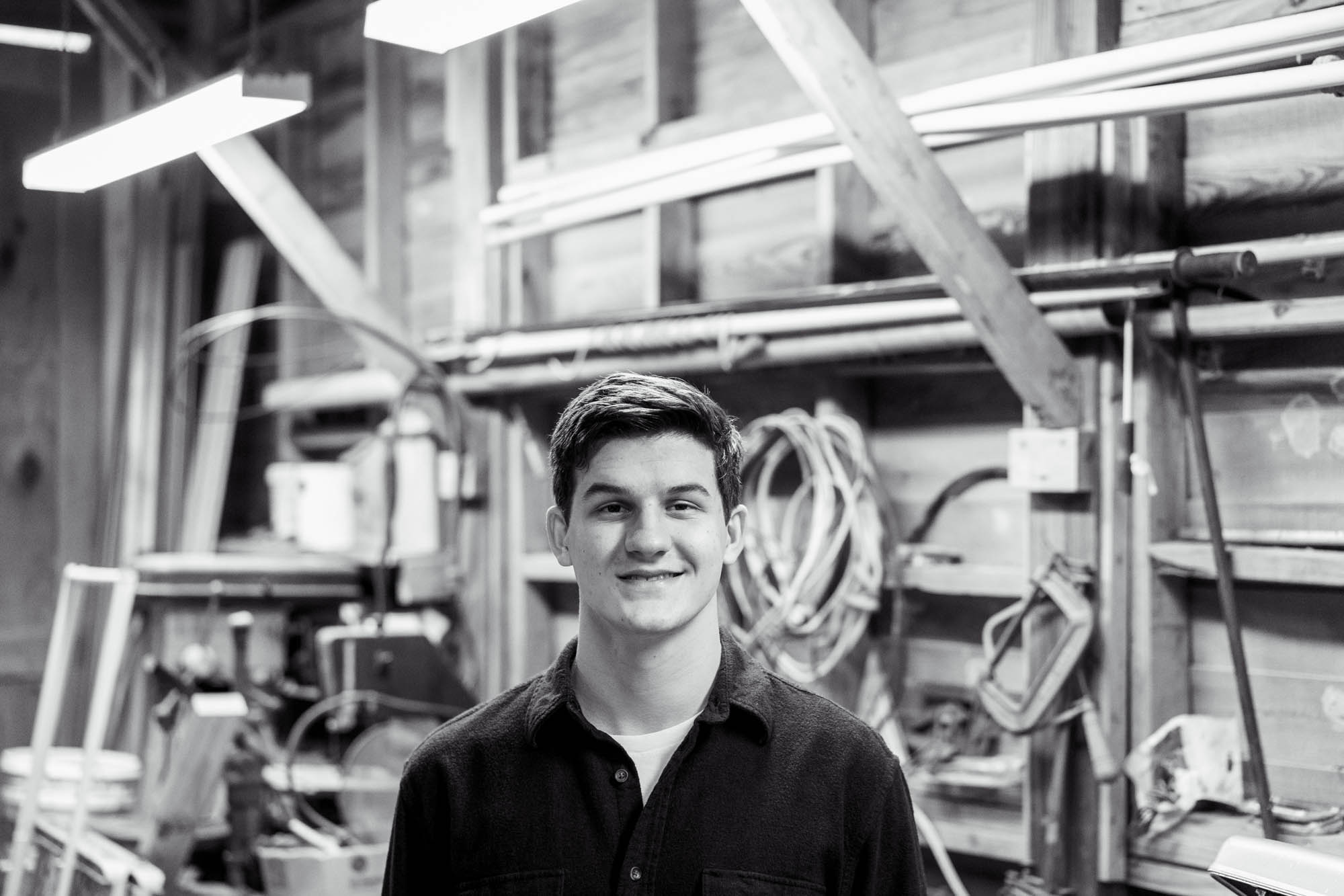 Senior smiling in his workshop
