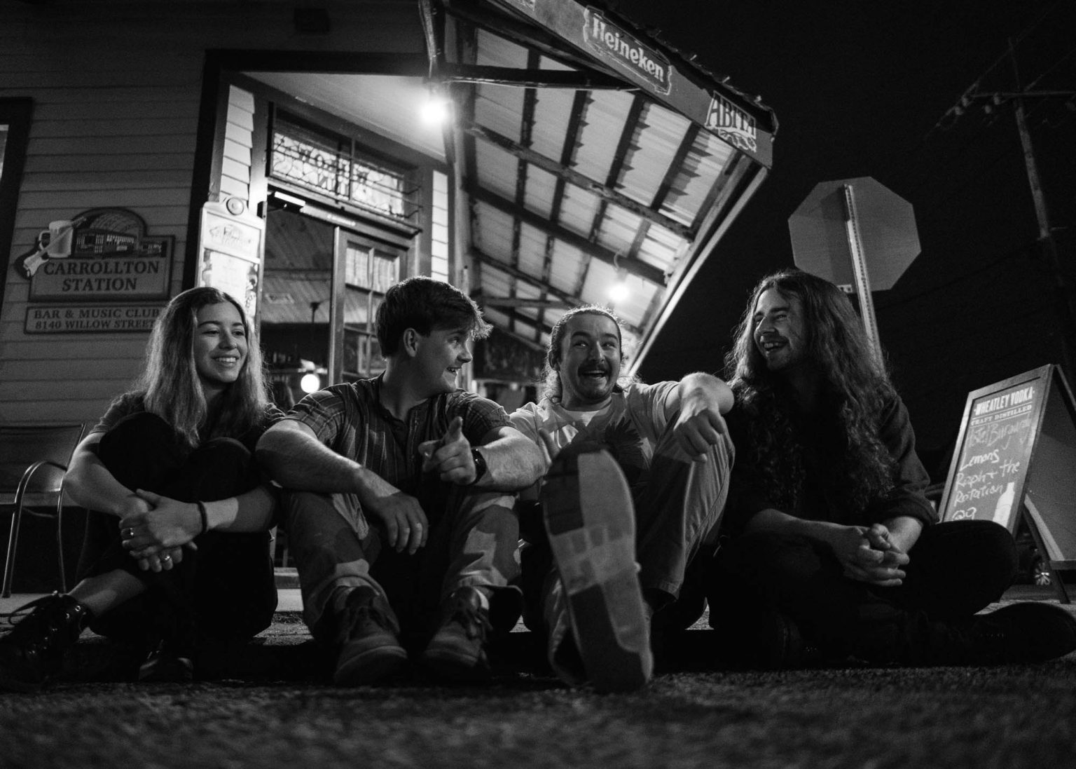 Lemon's band sitting on the curb before their show in New Orleans