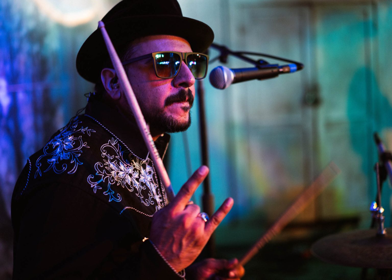 Drummer posing for the camera during show at Gruene Hall