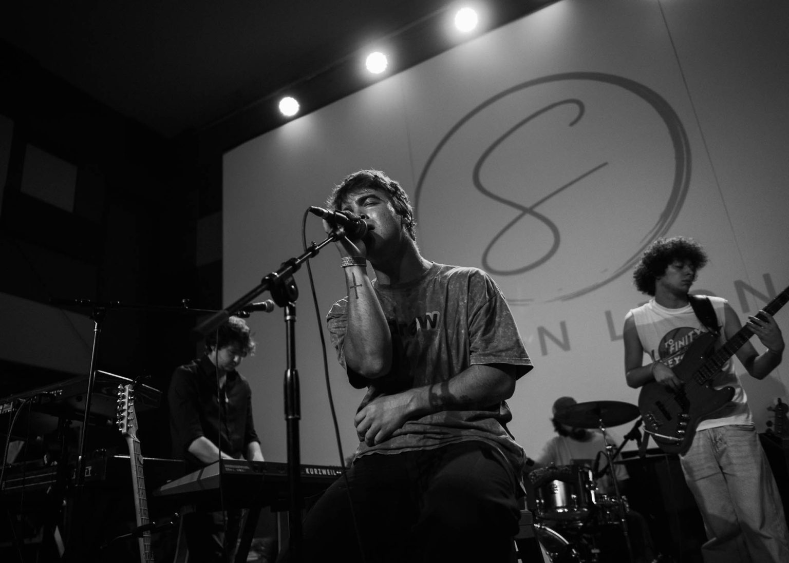 Simon Leone and band making music on stage in New Orleans