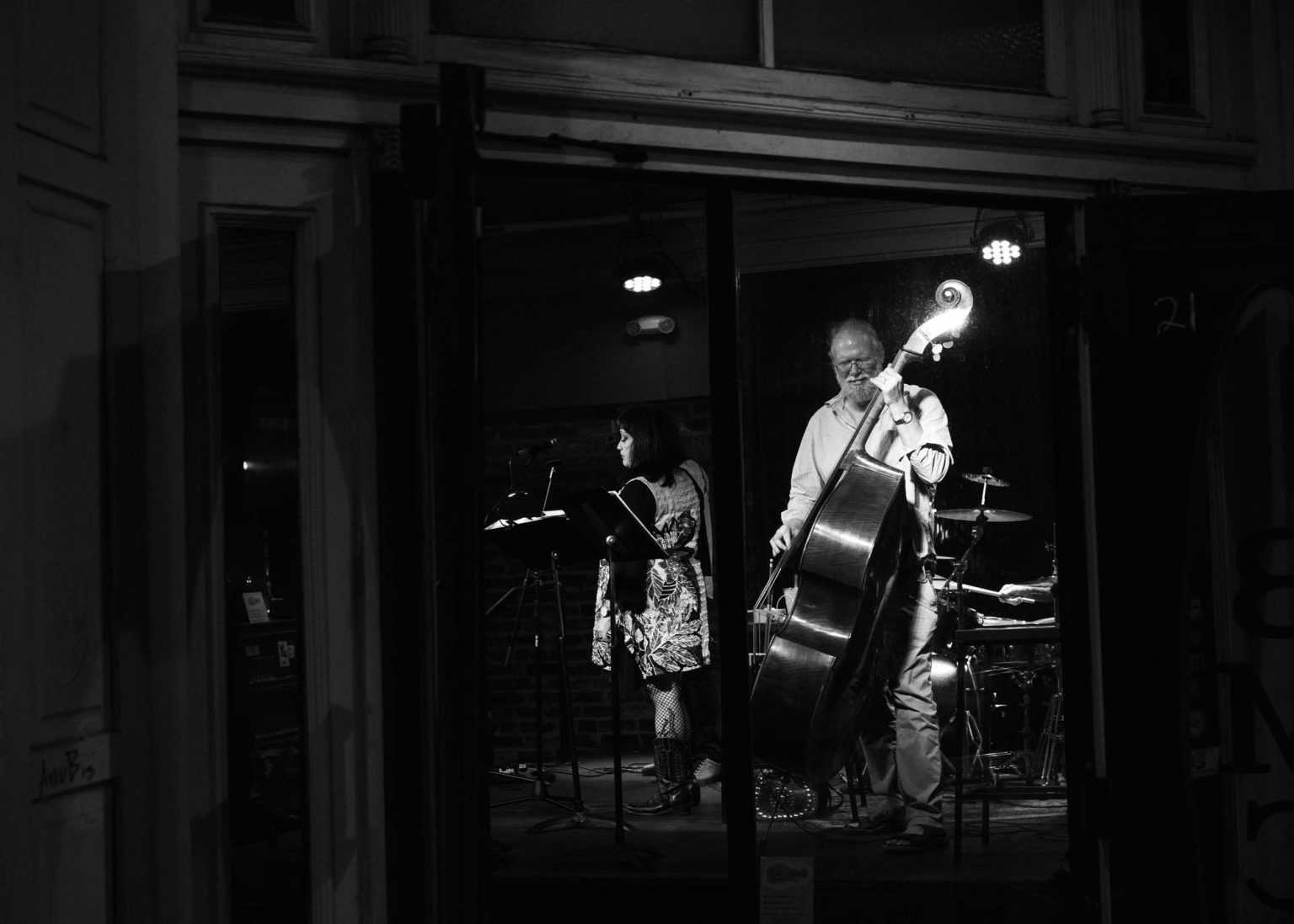 With his band playing a double bass live on stage in the French Quarter