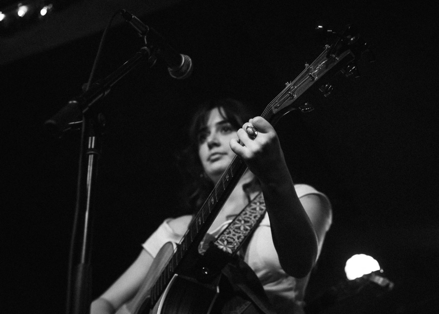 Singer and guitarist on stage at the Carrollton Station