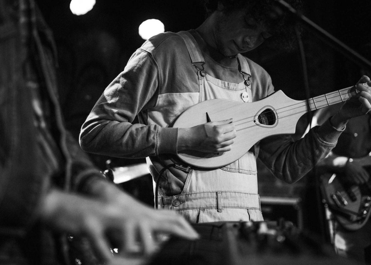 Members of the Olivia Barnes Band playing on stage in New Orleans