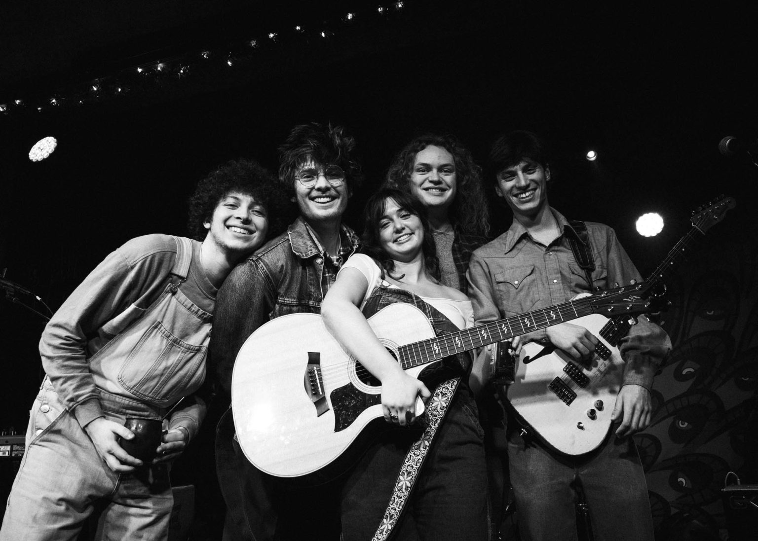 The Olivia Barnes Band right after their show posing and smiling at Carrollton Station in New Orleans