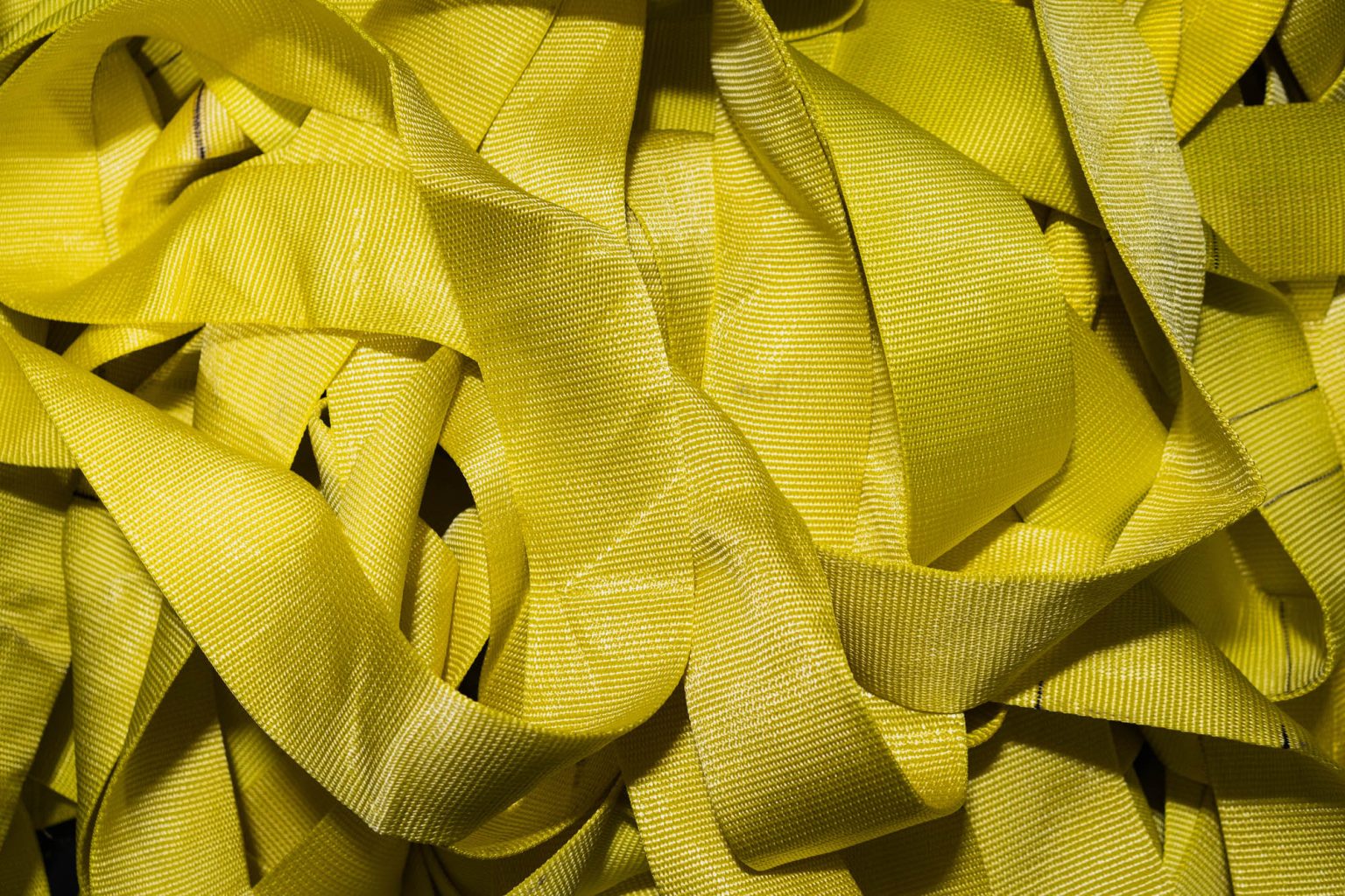 Yellow lifting sling material up close