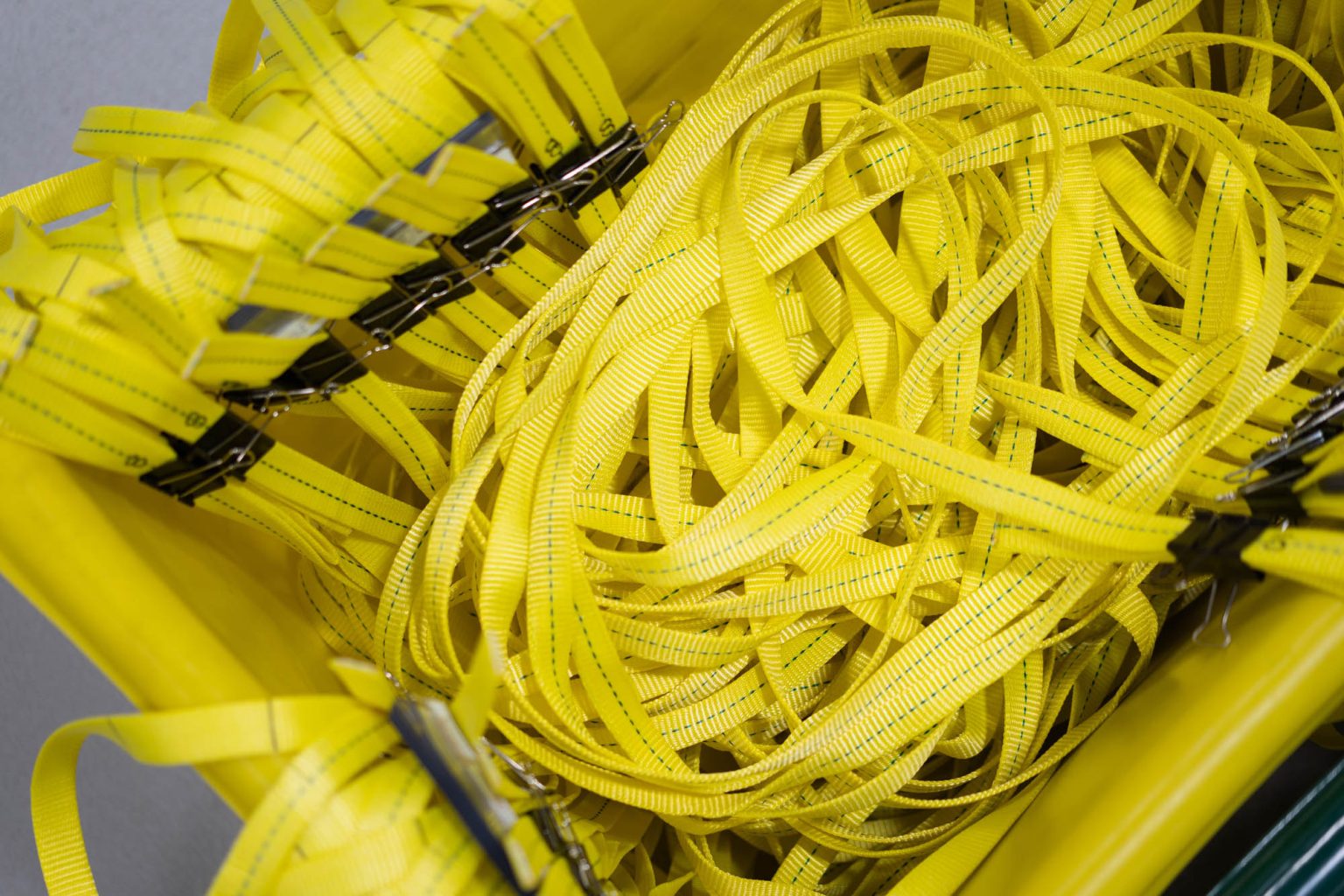 Yellow material in yellow bin to be used to create slings at Arabi Sling & Rigging