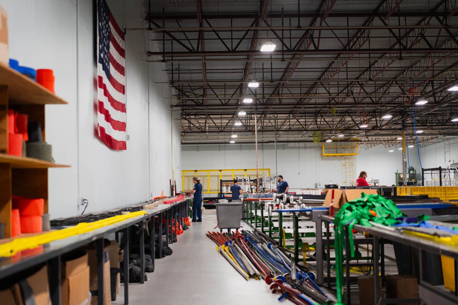 Well-lit facility for sling and rigging product with American flag hung on the wall