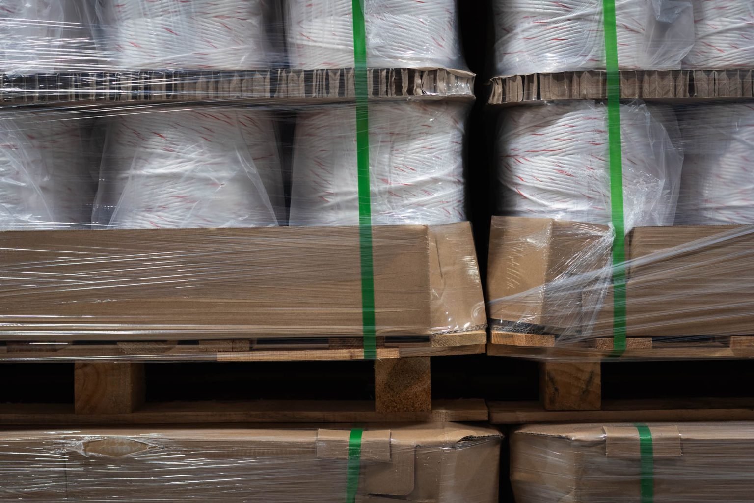 Multiple rolls of yarn in packaging on pallets