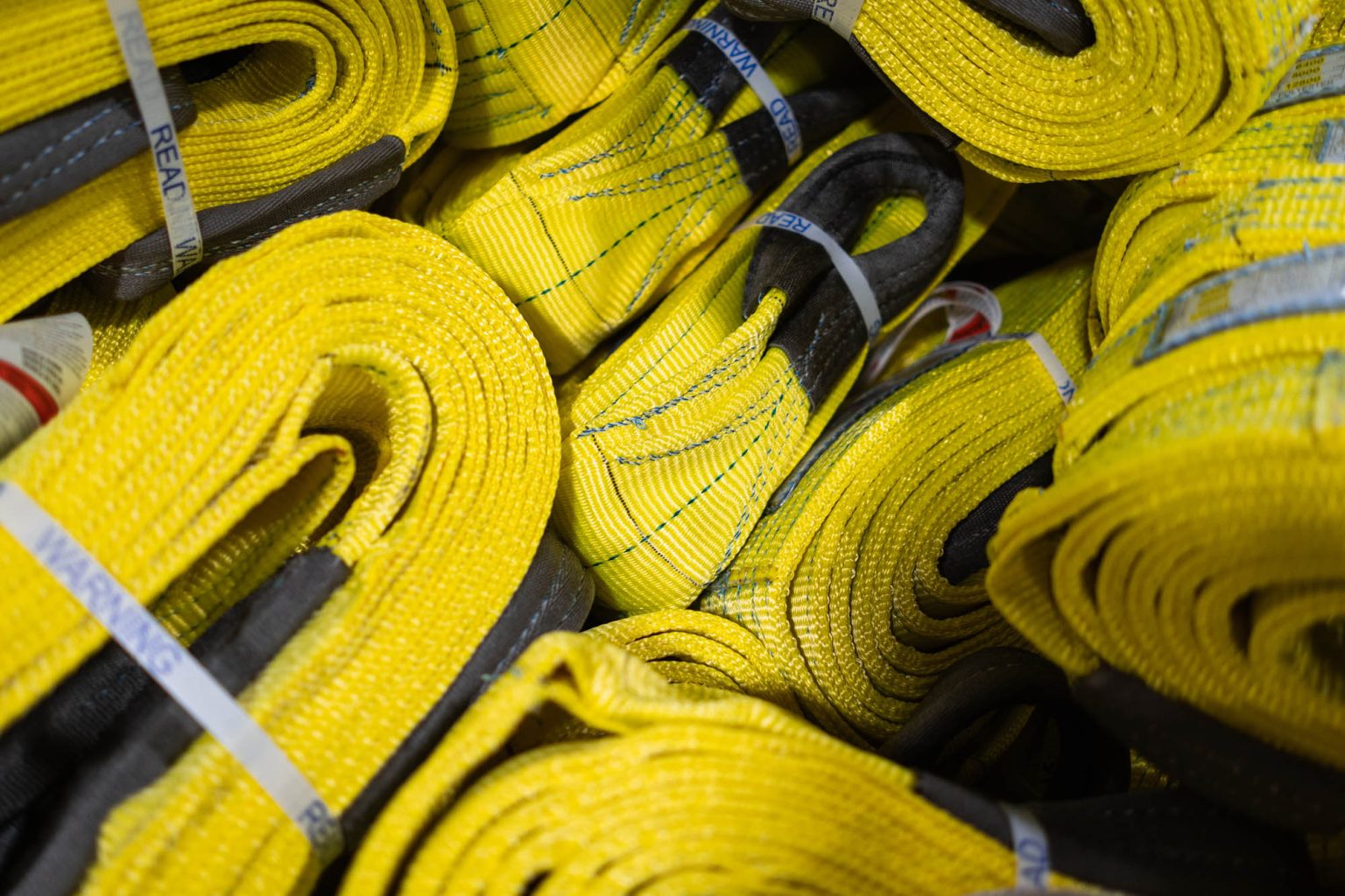 Yellow sling and rigging products in large bin