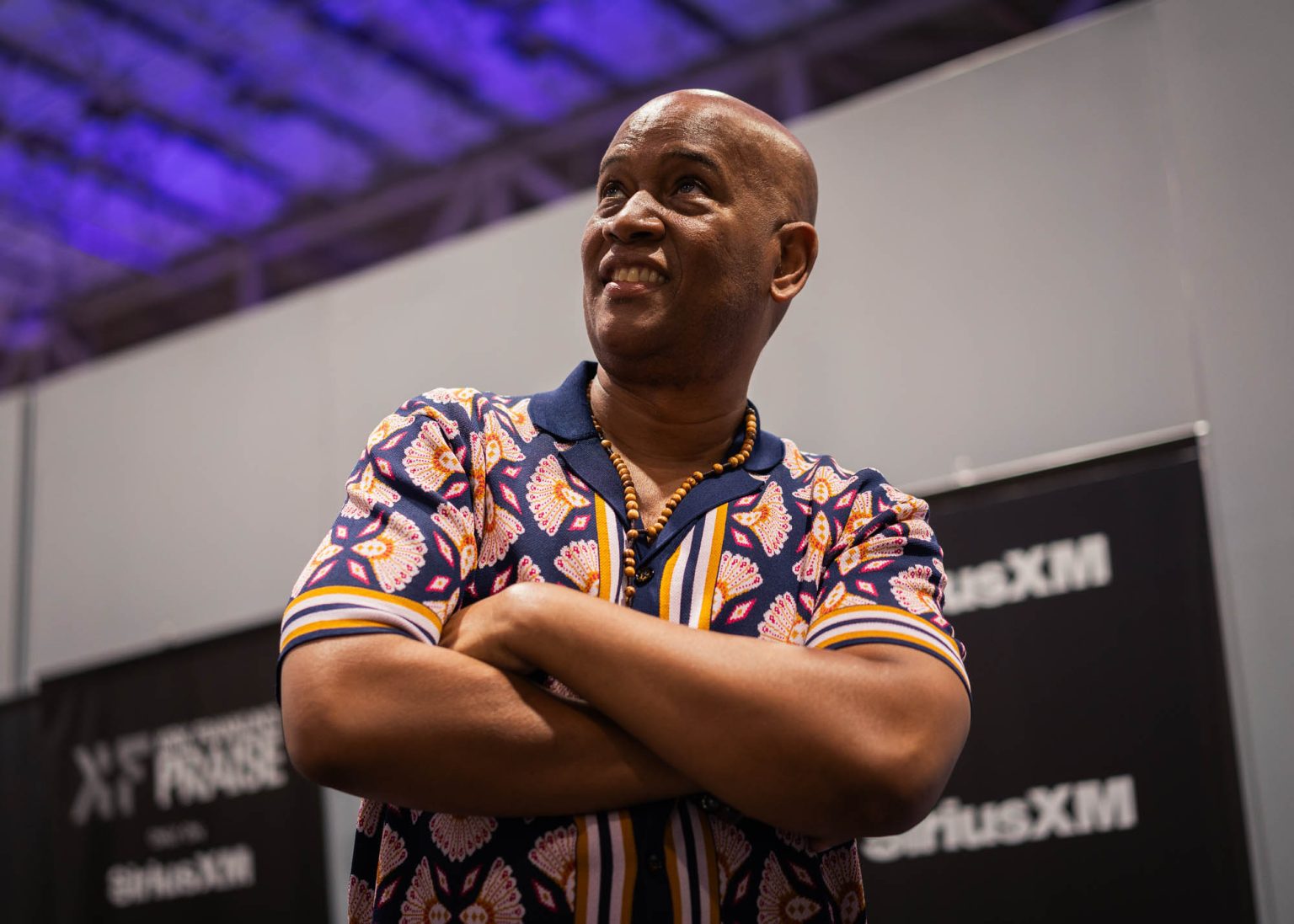 Smiling portrait and looking up with arms crossed