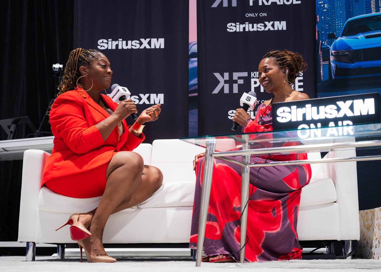 Talking with interviewer on a couch before her live rehearsal performance