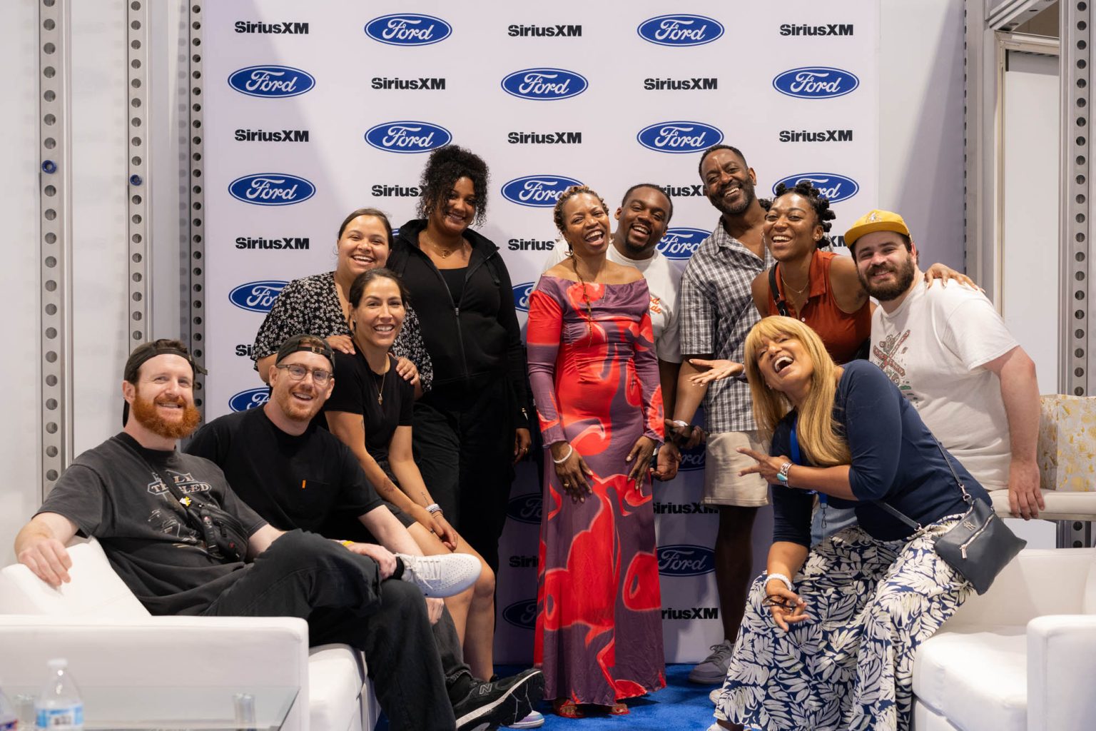 Group smiling and posing together after the event at the convention center