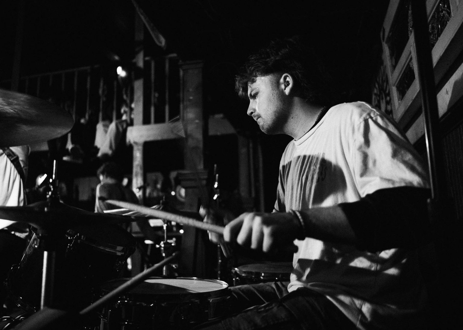 Drummer of the band Hotel Burgundy on stage play drums during their live performance